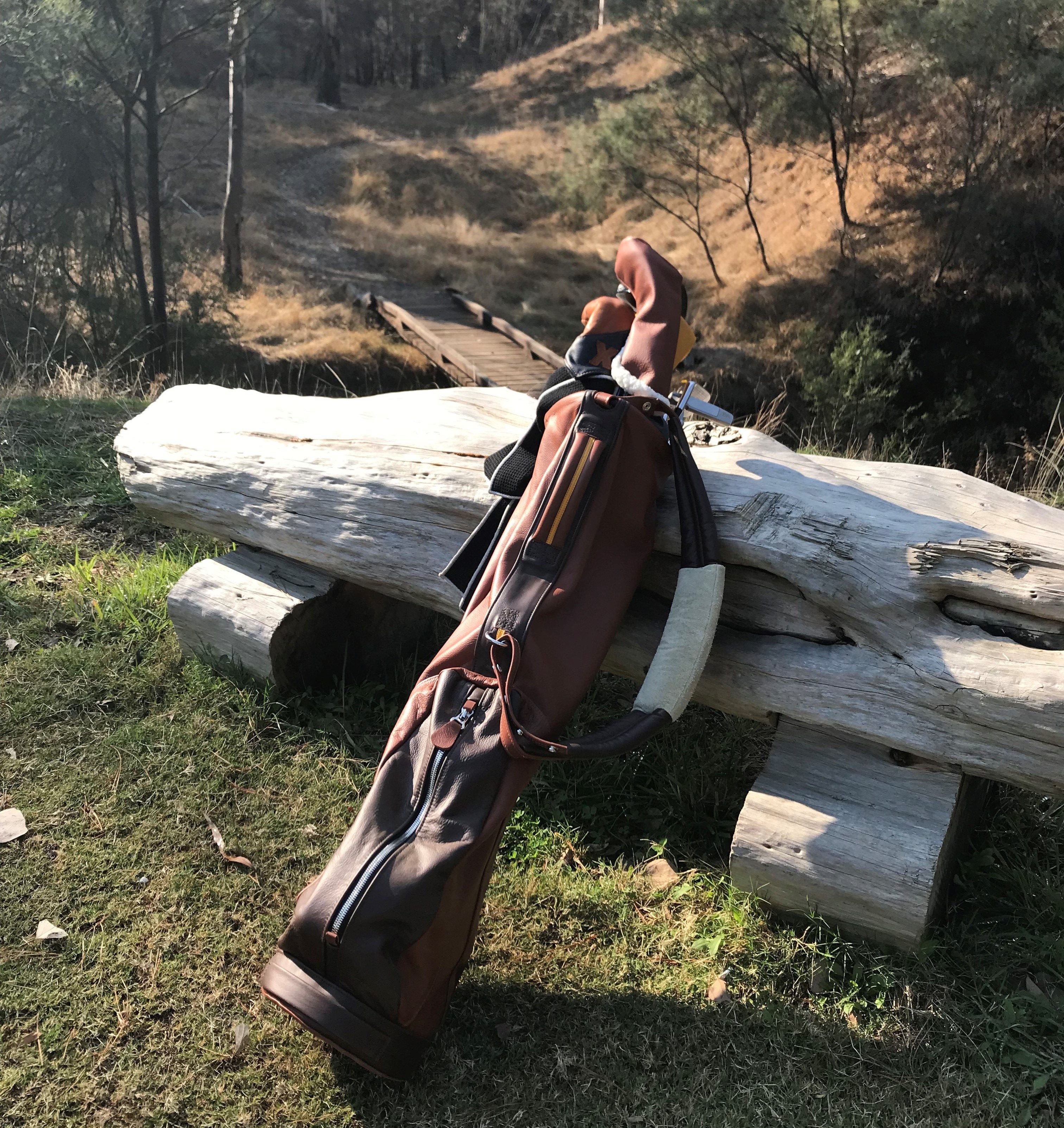 macdonald golf bag learning on a log